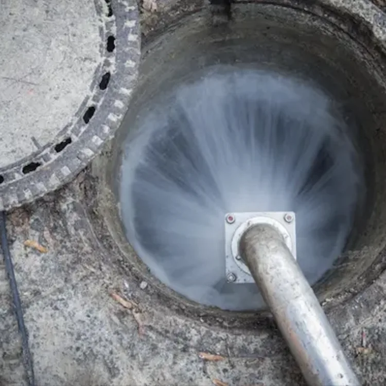 High-pressure hydro jetting service clearing built-up debris inside a commercial sewer pipe in the Finger Lakes